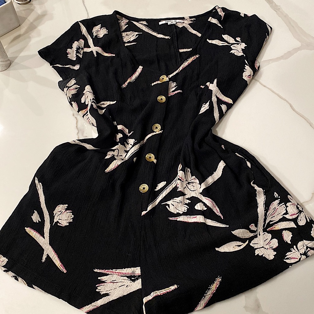 O’NEILL Black with white floral , one piece romper with side pockets